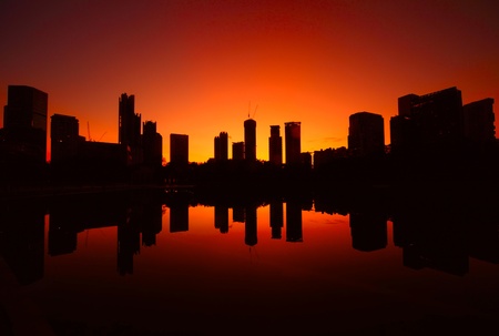 Building's silhouettes of a city with reflection in water. Kuala Lumpur. Malaysiaの写真素材