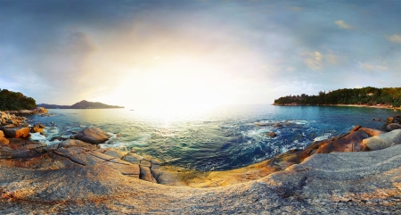 Panorama of a rocky coast of Andaman sea near Laem Sing beach at sunset. Phuket, Thailandの写真素材