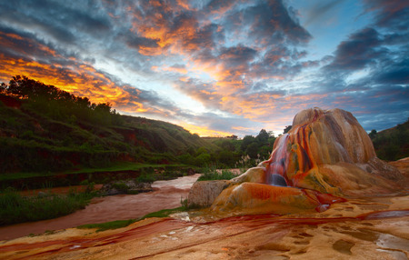 Red soil around Analavory geysers and sunrise sky. Madagascarの写真素材