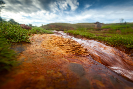 Red soil with patterns in the valley of Analavory geysers. Madagascar.の写真素材