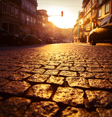 Street in the city of Porto at sunrise. Focus on the tilesの写真素材