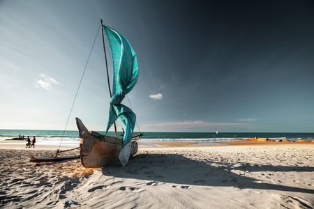 Traditional Malagasy sail boat on the sea coast. Town of Morondava, Madagascarの写真素材