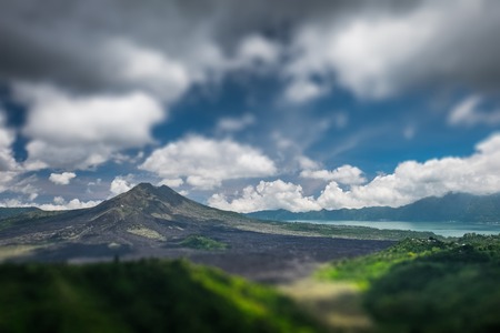 Caldera of the volcano of Batur at sunny day with clouds. Bali island, Indonesiaの写真素材