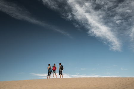 Hikers in the sandy desertの写真素材