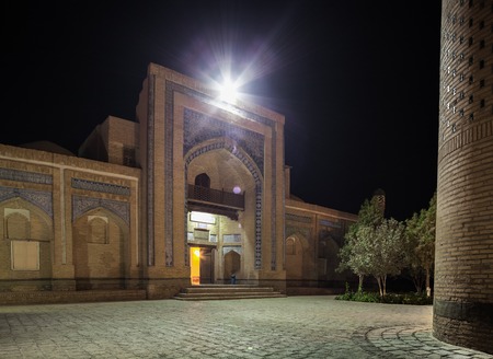 Oriental building with trees at night.The city of Khiva, Uzbekistanの写真素材