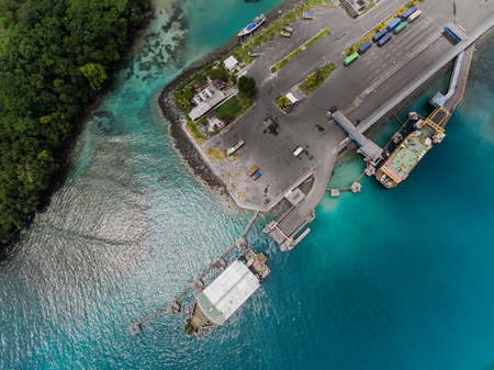 Aerial shot of the town of Padang Bai with marine port. Bali, Indonesiaの写真素材