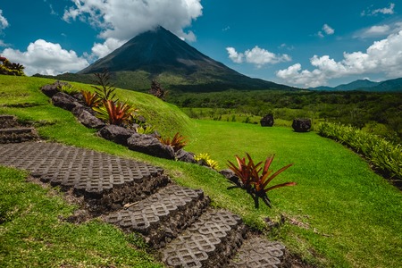Volcano of Arenal with stone stairs on the foreground at sunny day. Costa Ricaの写真素材