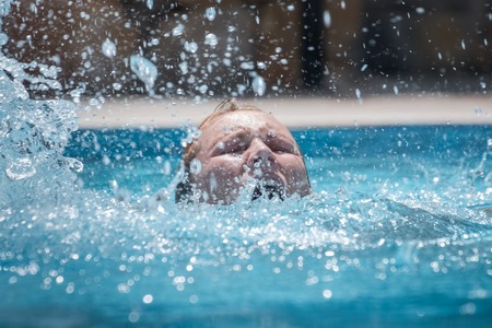 Person drowns in the pool with splashes