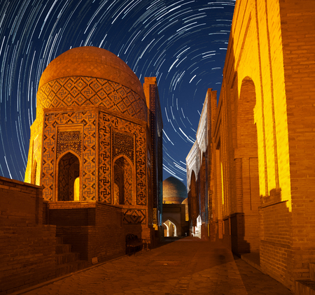 Ancient complex of buildings of Shakh i Zinda in the city of Samarkand with star trails, Uzbekistanの写真素材
