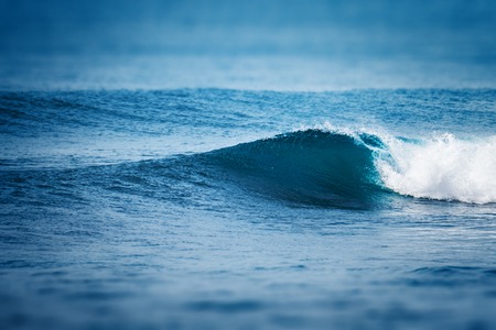 Ocean wave breaking on shoreの写真素材