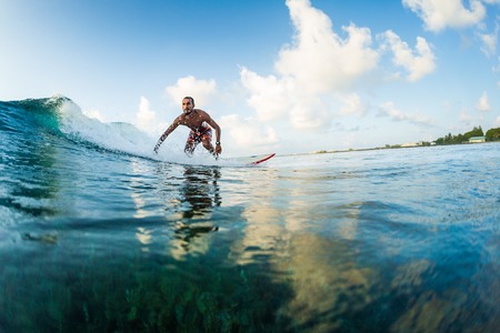 Surfer rides the wave. Extreme sport and active lifestyle conceptの写真素材