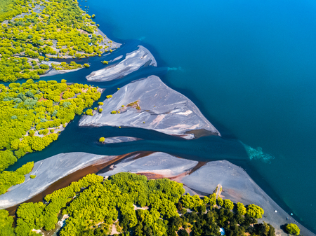 Aerial shot of a river flows into a lakeの写真素材