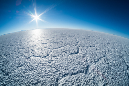Salar de Uyuni salt flat with cell patterns during sunrise, Boliviaの写真素材