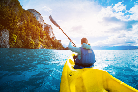 Woman paddles kayak on the lake of General Carrera, Patagonia, Chileの写真素材