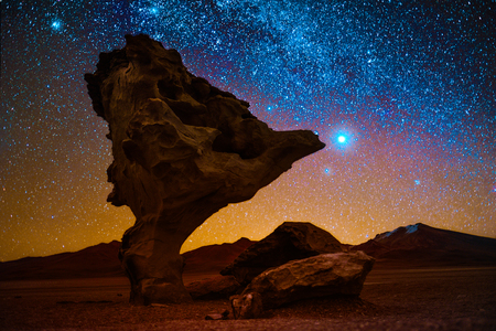 Rock formation named Arbol de Piedra in the desert with starry sky on the background. Boliviaの写真素材