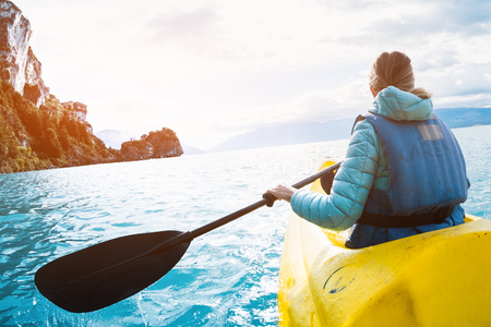 Woman paddles kayak on the lake of General Carrera, Patagonia, Chileの写真素材