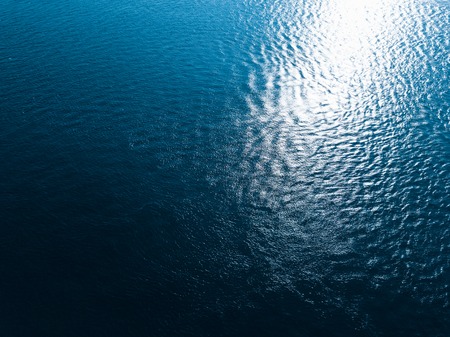 Sea surface aerial view. Wave pattern is broken due to sea currentsの写真素材
