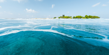 Tropical island and blue sea. View from low pointの写真素材