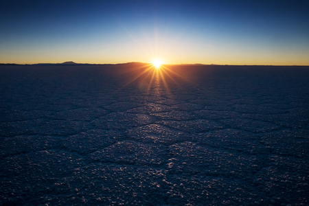 Salar de Uyuni at sunrise. Salt flat of the Salar de Uyuni during sunrise, Boliviaの写真素材