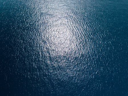 Sea surface aerial view with sunny reflectionの写真素材
