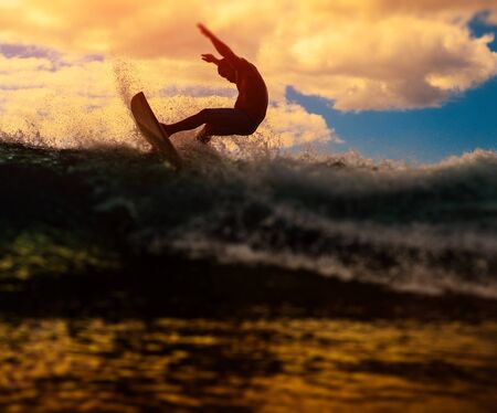 OAHU / USA - 28 NOVEMBER 2018:  Surfer rides ocean wave. Tilt shift effect appliedのeditorial素材