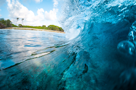 Ocean wave barrels at Honkeys surf spot in the Maldivesの写真素材