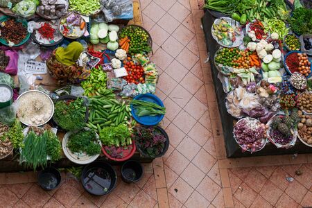 KOTA BHARU / MALASIA - FEBRUARY 26, 2013: Top down view of the stalls on asian market full of vegetables, herbs and other productsのeditorial素材