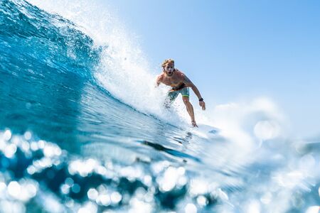HIMMAFUSHI / MALDIVES - MARCH 08, 2019: Surfer rides barreling crystal clear ocean waveのeditorial素材