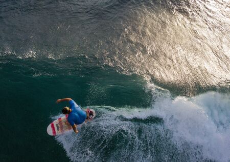 OAHU, HI / USA - NOVEMBER 15,2018: Surfer rides the ocean waveのeditorial素材
