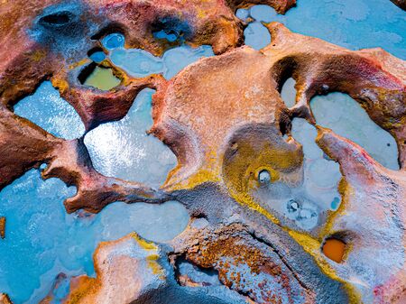 Aerial top down view of the geothermal area named Sol de Manana with sulfur springs and mud lakes in Bolivian Altiplanoの写真素材