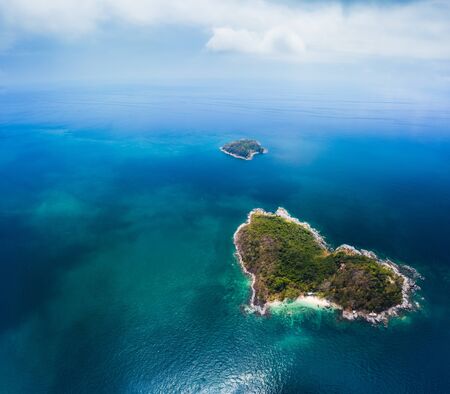 Heart shaped island in the calm tropical sea. Thailandの写真素材