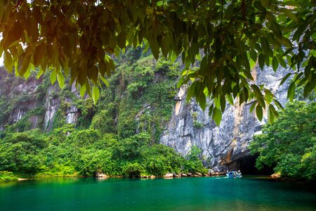 Tien Son cave entrance with lush vegetation around. Vietnamの写真素材