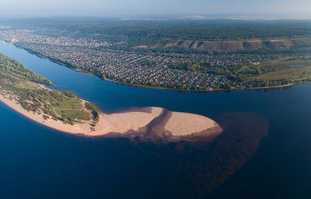 Aerial view of the river of Volga near the city of Tolyatti with sandy coast during a calm sunrise, Russiaの写真素材