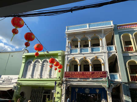 PHUKET TOWN , THAILAND, FEBRUARY 13, 2020: Decorated street with ancient buildings in the Phukets Old Town. One building has the supportive banner for Wuhan people saying "China, Wuhan be strong. You will never walk alone"のeditorial素材