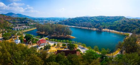 Aerial panorama of the lake and Buddhist temple near the beach of Nai Harn on Phuket island in Thailandの写真素材