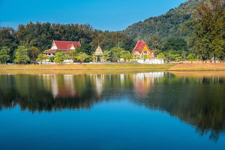 Temple with its reflection in the lake on the Nai Harn beach in Phuket, Thailandの写真素材