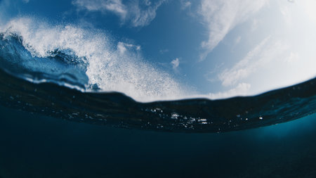 Crystal clear ocean wave breaks on the shore in the Maldivesの写真素材