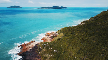 Aerial view of the green coastline in Brazil with remote islands on the horizonの写真素材