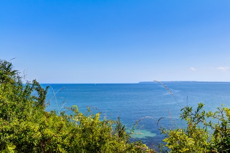 Open water and blue sky in summer on Rugen, Germanyの写真素材