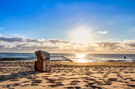 Beach chairs in the morning after sunriseの写真素材