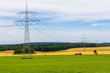Single electricity pylon with power cables in Germanyの写真素材