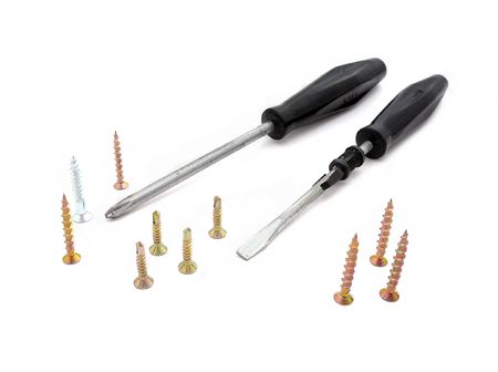 screwdrivers and screws isolated on whiteの写真素材