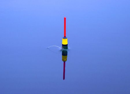 float on the tranquil blue water of lakeの写真素材