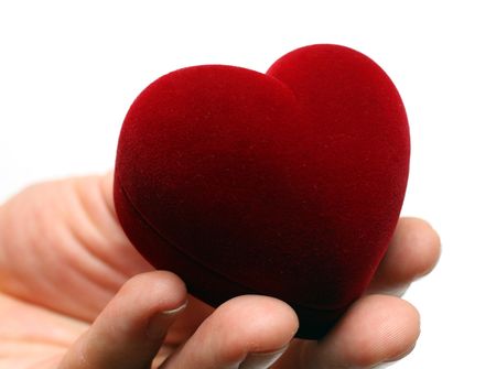 man's hand gidting heart on valentine day isolated on whiteの写真素材