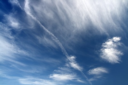 deep blue sky with clouds background