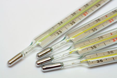 influenza epidemic concept - group of medicine thermometersの写真素材