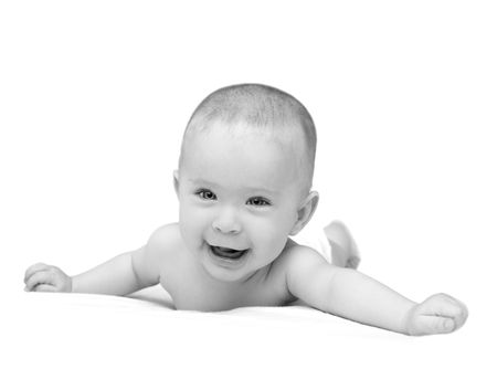 happy baby crawling on white sheetの写真素材