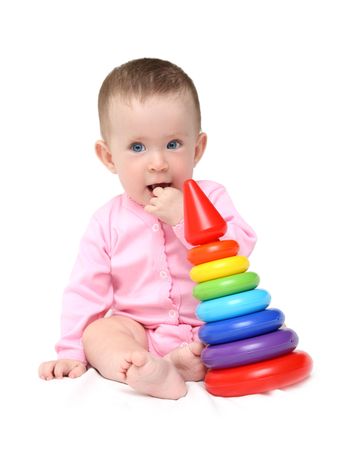 cute baby girl with pyramid isolated on whiteの写真素材