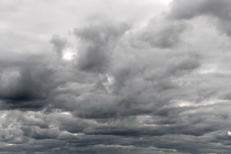 dull cloudy gray overcast sky backgroundの写真素材