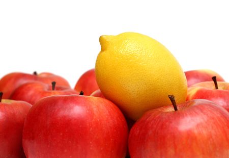 different concepts - lemon between red applesの写真素材